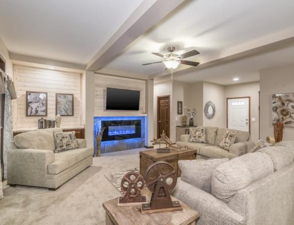 Manufactured home with a large living room and fireplace.